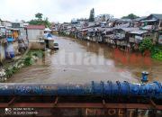 Polsek Matraman Tinjau Genangan Air di Sungai Ciliwung